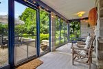 You will love relaxing on the screen porch overlooking the backyard